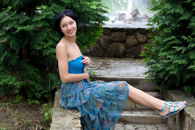 Blue dress woman sitting waterfall free wallpaper for desktop - medium preview image