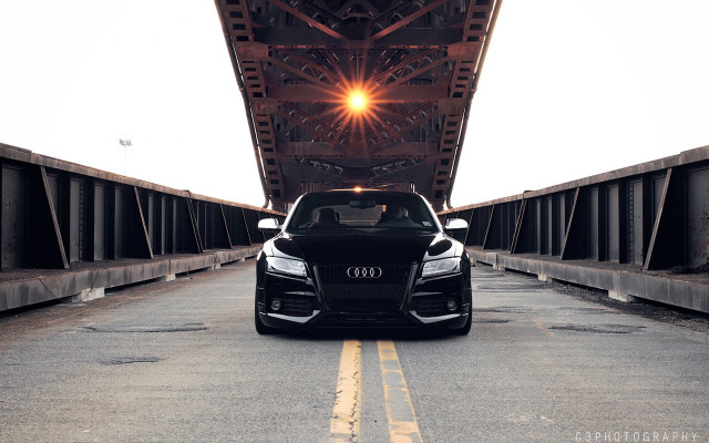 Black car driving bridge bright free wallpaper for desktop - medium preview image