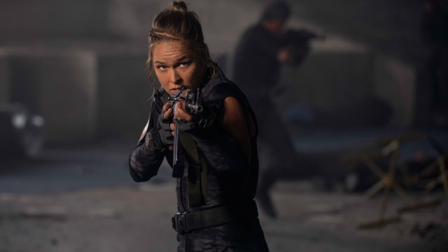 Woman holding gun dark room free wallpaper for desktop - medium preview image