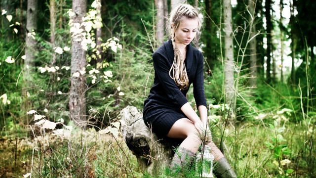 Woman sitting rock forest background free wallpaper for desktop - medium preview image