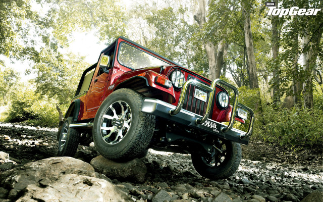 Red jeep driving rocks woods free wallpaper for desktop - medium preview image