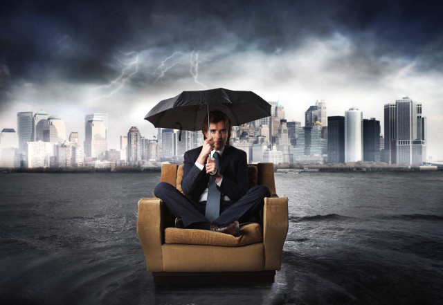 Man sitting chair umbrella city free wallpaper for desktop - medium preview image