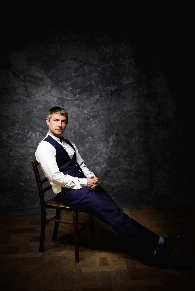 Man sitting black room elegant free wallpaper for mobile - medium preview image