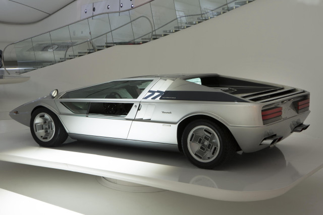 Silver sports car museum staircase free wallpaper for desktop - medium preview image