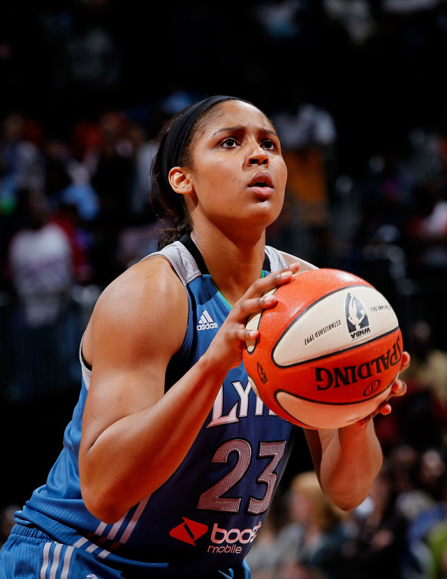 Woman holding basketball looking up free wallpaper for mobile - medium preview image