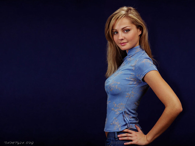 Woman blue shirt jeans hands free wallpaper for desktop - medium preview image