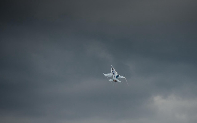 Plane flying dark sky clouds free wallpaper for desktop - medium preview image