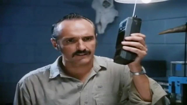 Man holding cell phone weird free wallpaper for desktop - medium preview image