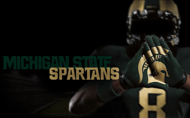 Football player green uniform michigan free wallpaper for desktop - medium preview image