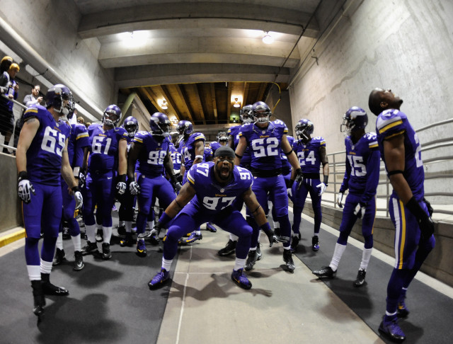 Football players tunnel uniforms helmets free wallpaper for desktop - medium preview image