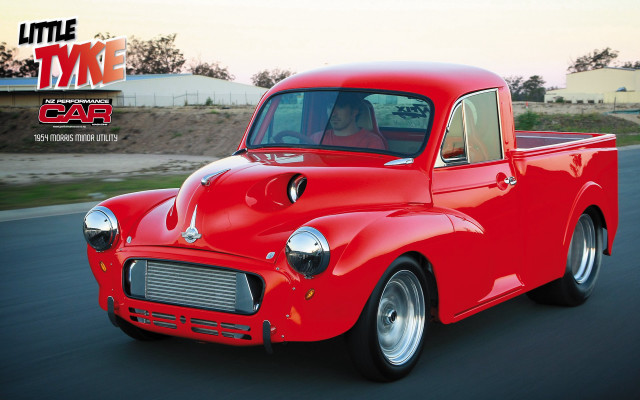 Red car driving street building #4 free wallpaper for desktop - medium preview image