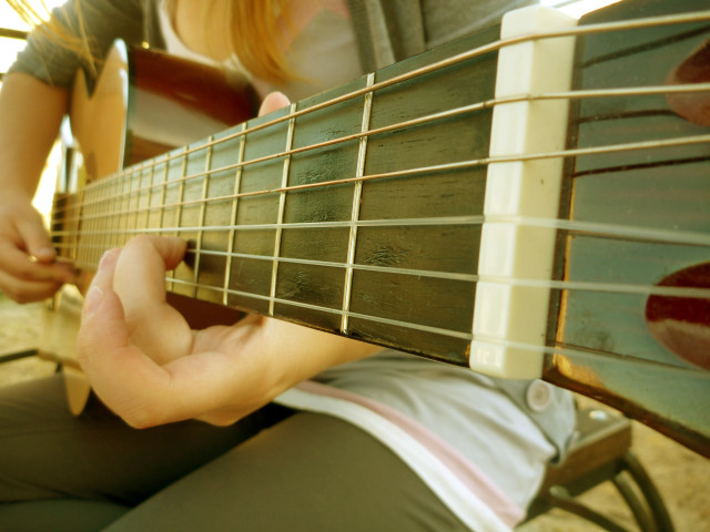 Person playing guitar hands strings #4 free wallpaper for desktop - medium preview image