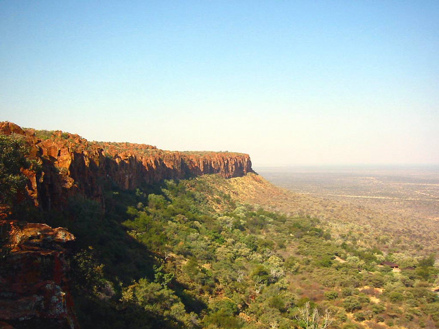 Valley trees cliff blue sky free wallpaper for desktop - medium preview image