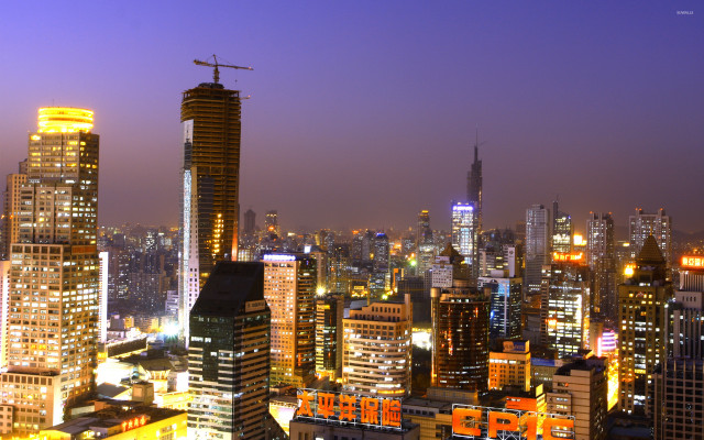 City skyline night cranes buildings free wallpaper for desktop - medium preview image