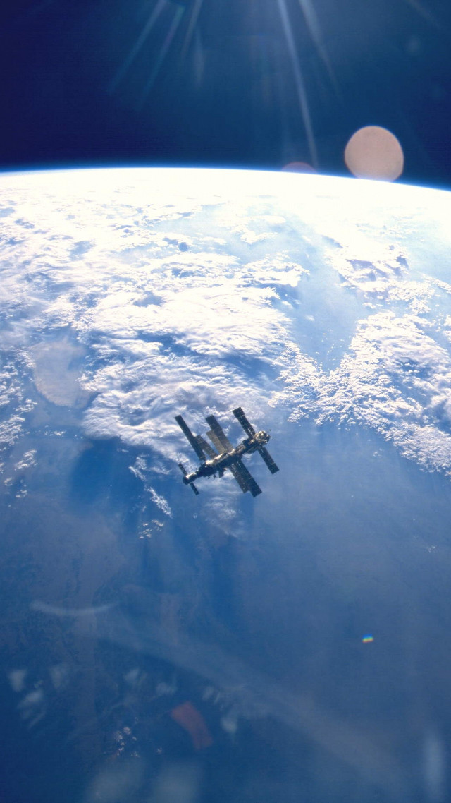 Space shuttle flying earth sunlight free wallpaper for mobile - medium preview image