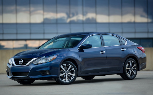 Blue car parked building sky free wallpaper for desktop - medium preview image