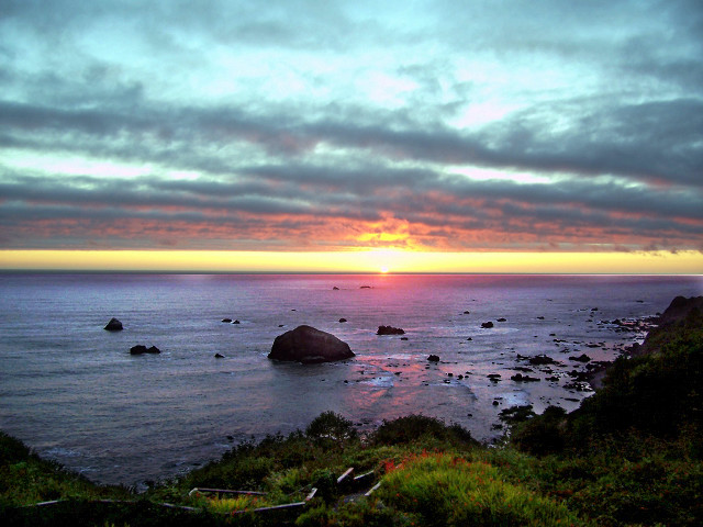 Sunset ocean rocky shore saturated free wallpaper for desktop - medium preview image