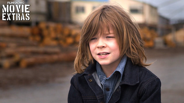 Young boy jacket pile logs free wallpaper for desktop - medium preview image