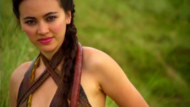 Woman braids grassy field camera free wallpaper for desktop - medium preview image