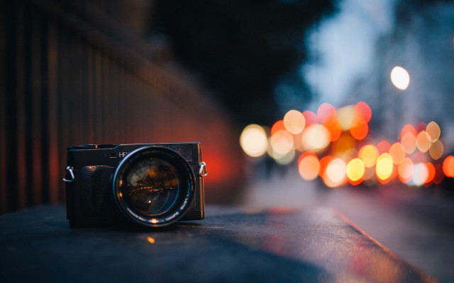 Camera ledge blurry lights moon free wallpaper for desktop - medium preview image