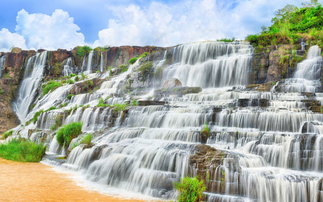 Waterfall brown river blue sky free wallpaper for desktop - medium preview image