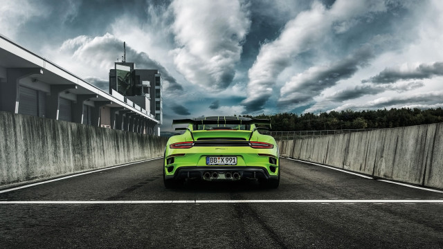 Green sports car cloudy sky free wallpaper for desktop - medium preview image