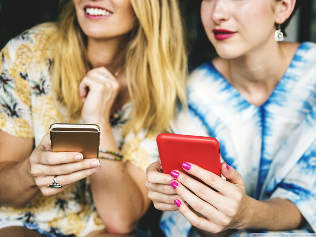 Women sitting cell phones together #2 free wallpaper for desktop - medium preview image