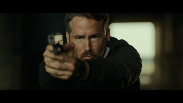 Man pointing gun serious expression free wallpaper for desktop - medium preview image