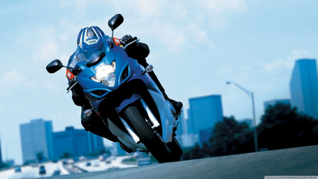 Motorcycle driving road city skyline free wallpaper for desktop - medium preview image