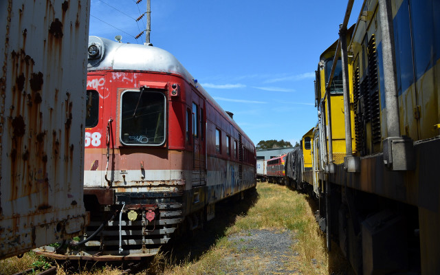Train parked tracks field grass free wallpaper for desktop - medium preview image
