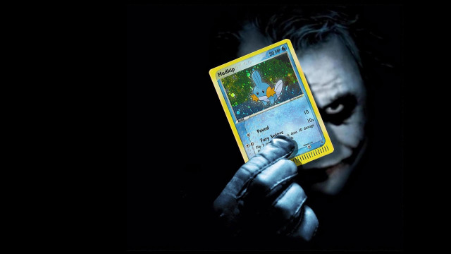 Man holding joker card batman free wallpaper for desktop - medium preview image