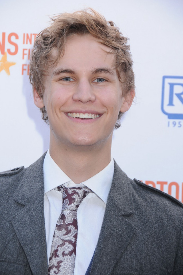 Young man suit smile event free wallpaper for mobile - medium preview image