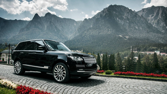 Black range rover cobblestone road free wallpaper for desktop - medium preview image
