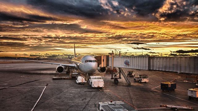 Plane parked tarmac airport sunset #2 free wallpaper for desktop - medium preview image