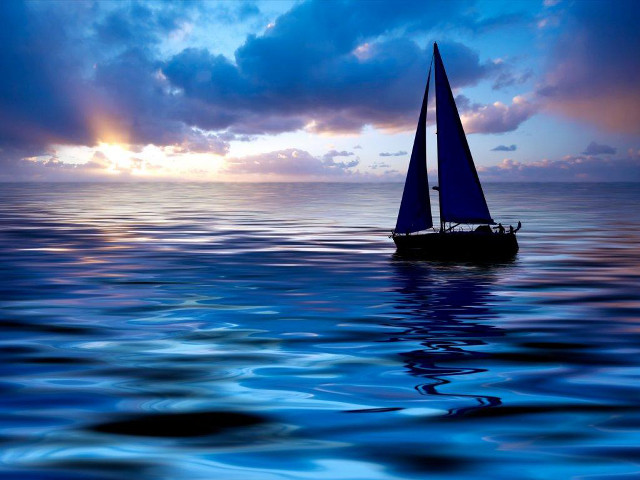 Sailboat ocean sunset dawn clouds free wallpaper for desktop - medium preview image
