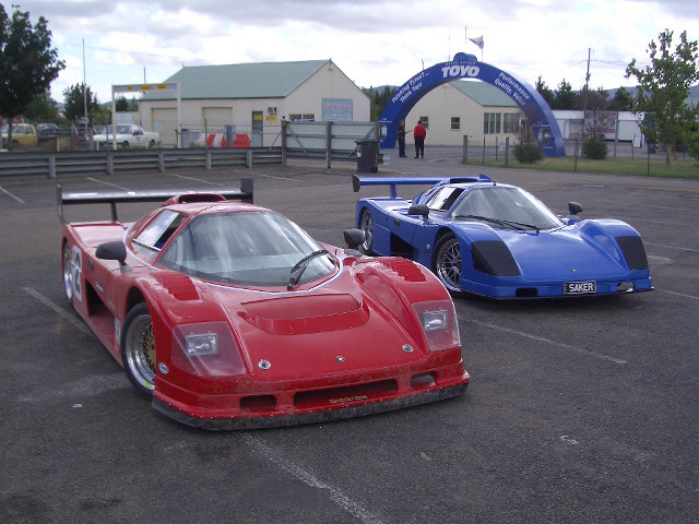 Race cars parking lot blue free wallpaper for desktop - medium preview image