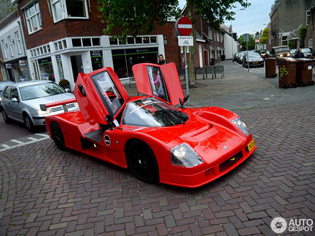Red sports car brick road free wallpaper for desktop - medium preview image