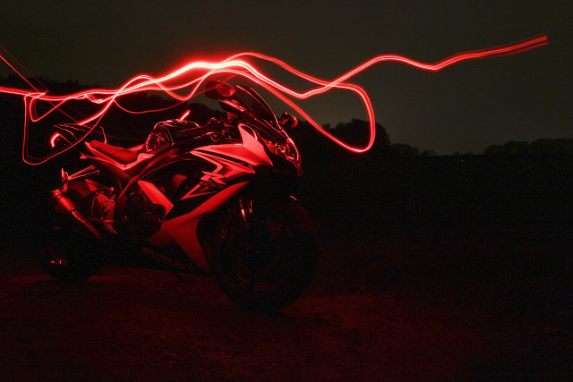 Motorcycle red light dark blurry free wallpaper for desktop - medium preview image
