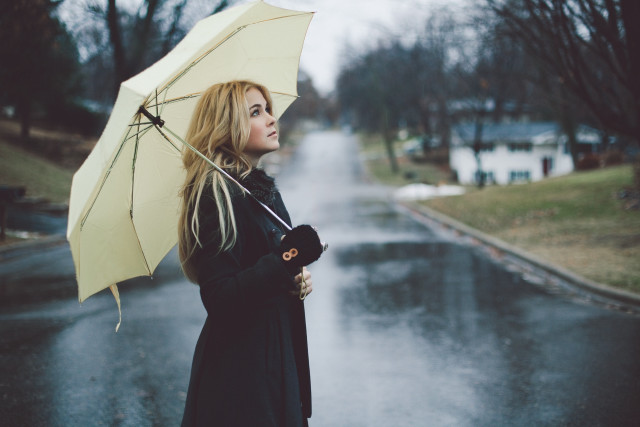 Woman holding umbrella wet road free wallpaper for desktop - medium preview image