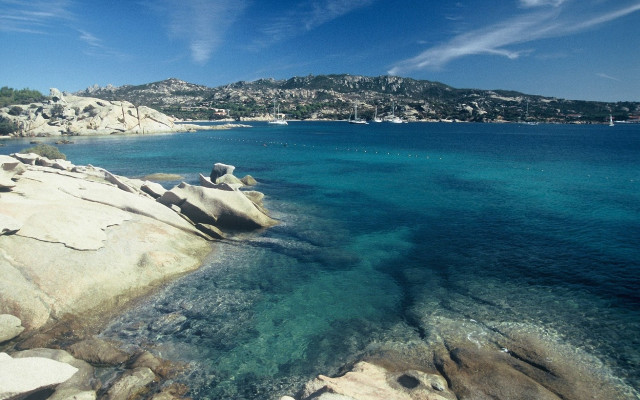 Water rocks mountains boat scenery free wallpaper for desktop - medium preview image