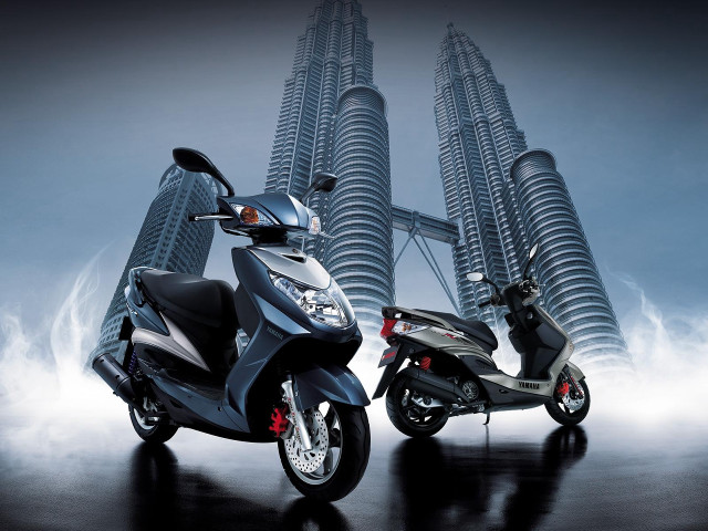 Motorcycles parked tall building spire free wallpaper for desktop - medium preview image