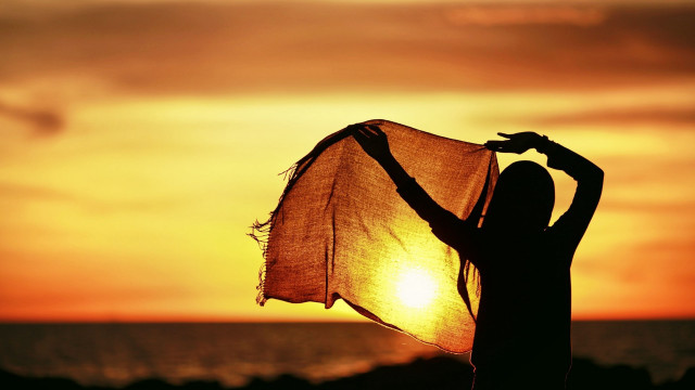 Woman scarf sunset ocean sun free wallpaper for desktop - medium preview image