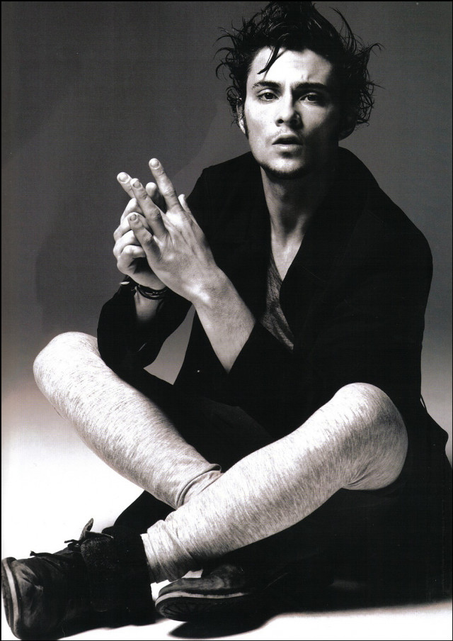 Man sitting smoking cigarette hands free wallpaper for mobile - medium preview image