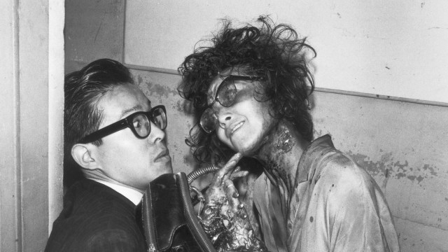 Man woman makeup bathroom stall free wallpaper for desktop - medium preview image