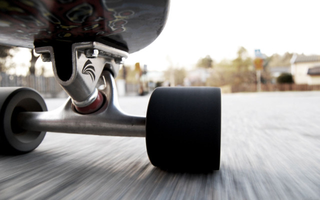 Skateboarder riding street wheels down free wallpaper for desktop - medium preview image