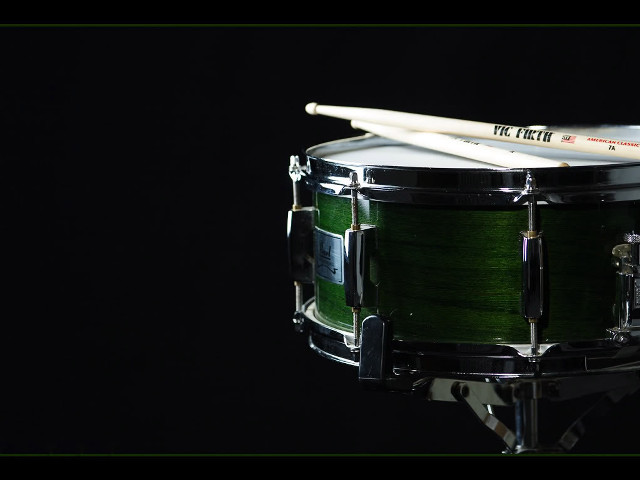 Green drum drumsticks black background free wallpaper for desktop - medium preview image