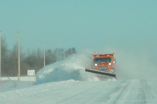 Snow plow driving snowy road free wallpaper for desktop - medium preview image