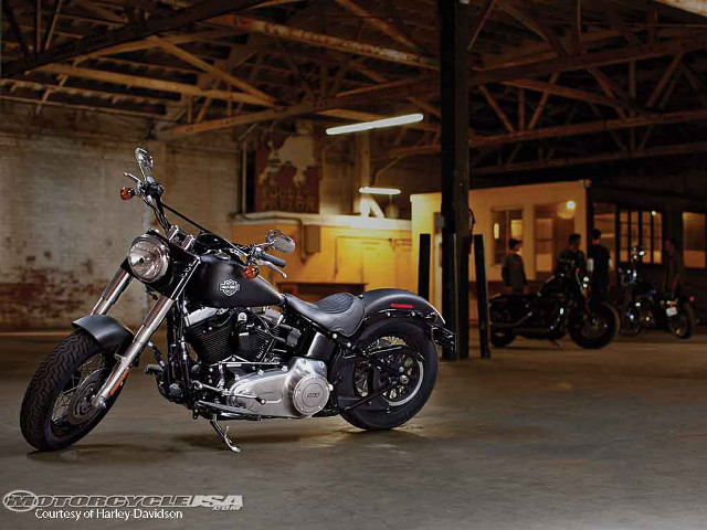 Motorcycle parked garage background building free wallpaper for desktop - medium preview image