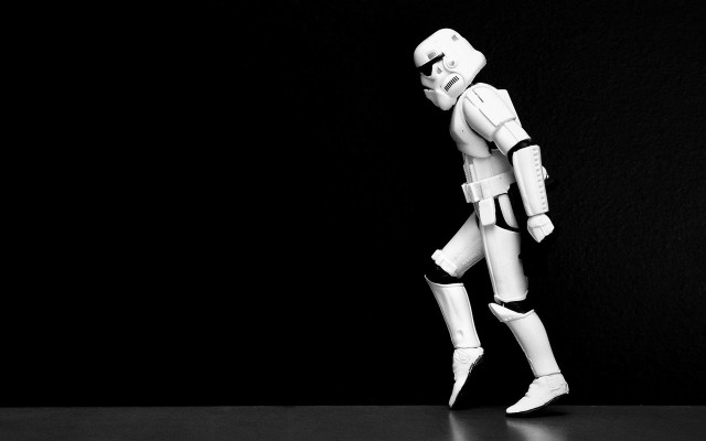 Stormtrooper toy figure walking table free wallpaper for desktop - medium preview image