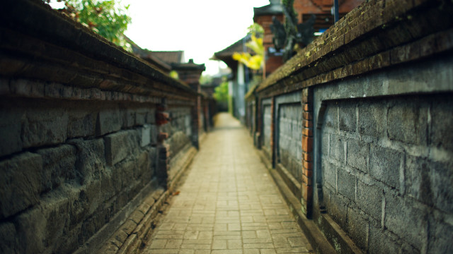 Brick walkway between buildings clock free wallpaper for desktop - medium preview image
